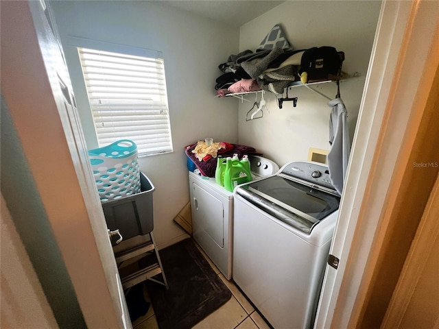 laundry room with light tile patterned floors, laundry area, and independent washer and dryer