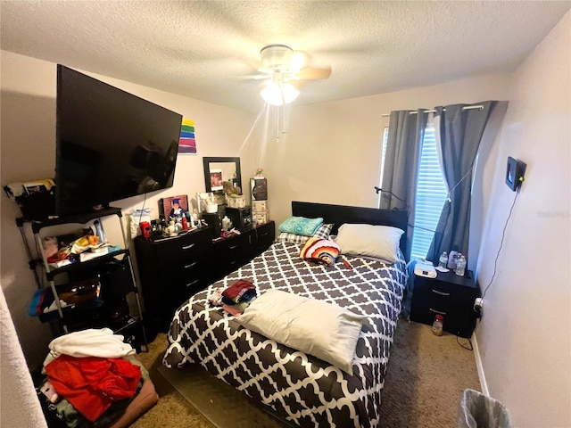 bedroom featuring carpet, ceiling fan, and a textured ceiling