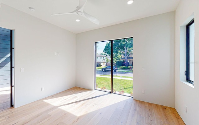 unfurnished room featuring ceiling fan and light hardwood / wood-style floors