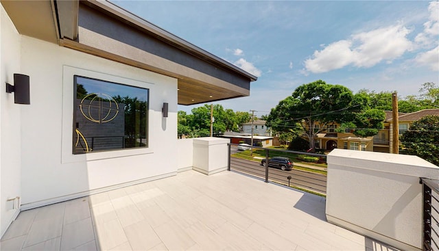 view of patio featuring a balcony