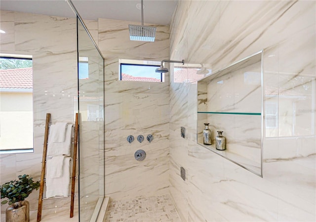 bathroom featuring tiled shower