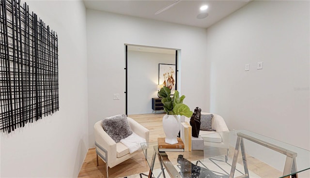 sitting room with hardwood / wood-style flooring