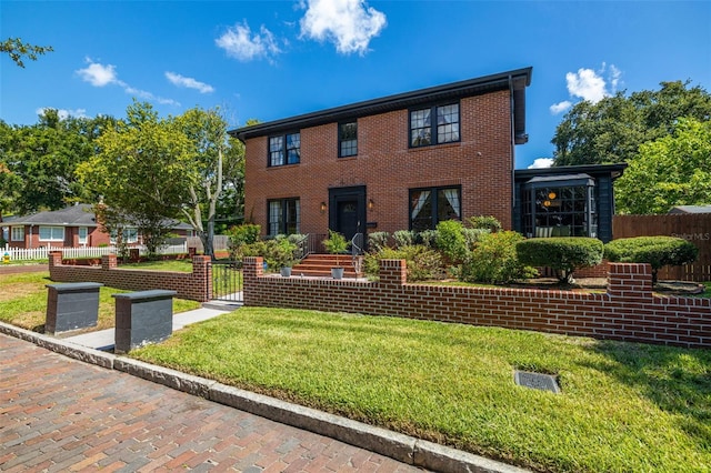 colonial inspired home featuring a front lawn