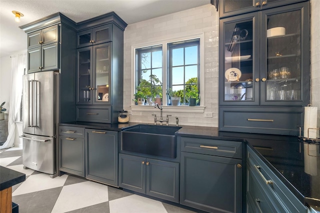 bar featuring high end fridge and sink