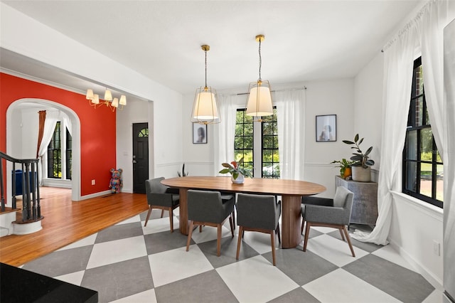 dining area featuring a chandelier and wood-type flooring