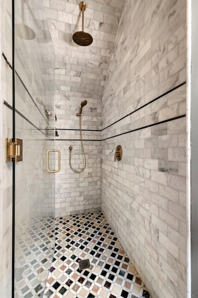 bathroom featuring an enclosed shower and vaulted ceiling