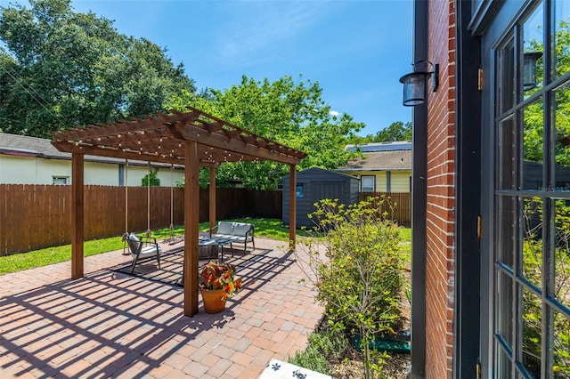 view of patio / terrace featuring a pergola and a storage shed