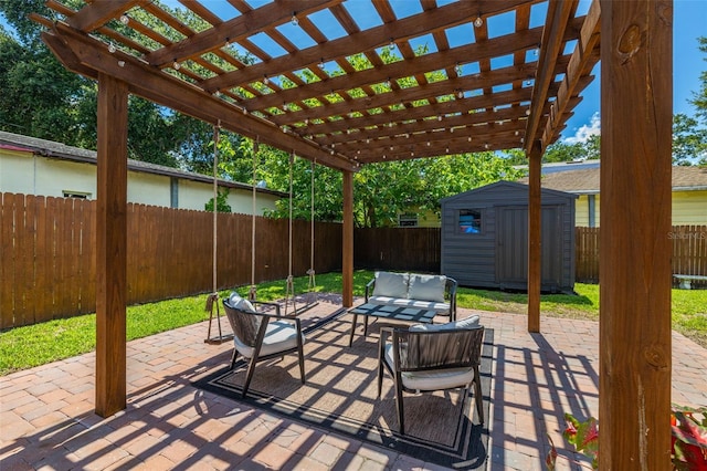 view of patio / terrace featuring outdoor lounge area, a shed, and a pergola