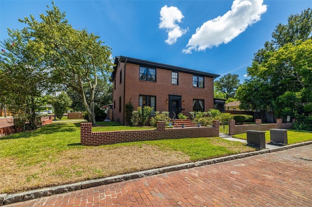 colonial inspired home featuring a front yard