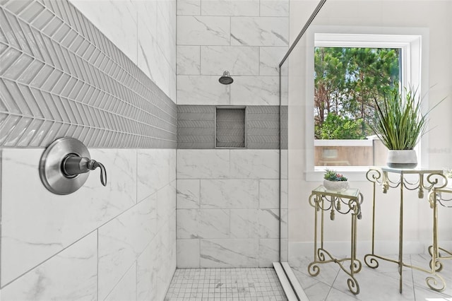 bathroom featuring tiled shower