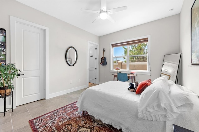 bedroom featuring ceiling fan and light tile patterned floors