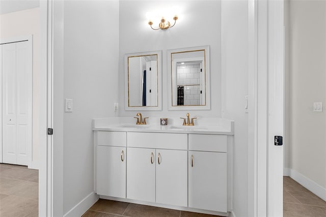 bathroom featuring tile patterned flooring and vanity