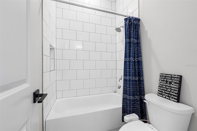 bathroom featuring toilet and shower / tub combo