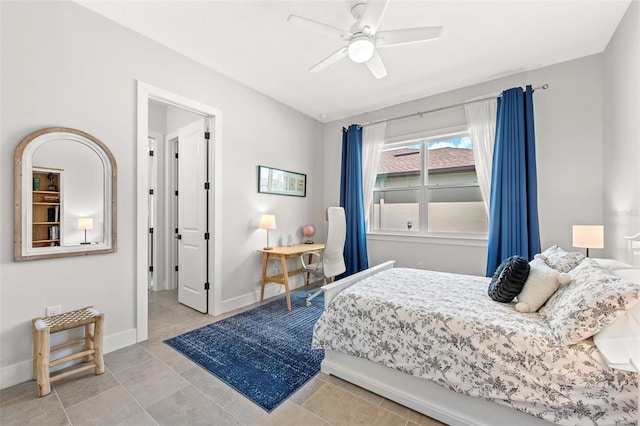 tiled bedroom with ceiling fan