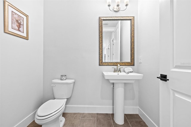 bathroom with tile patterned flooring and toilet