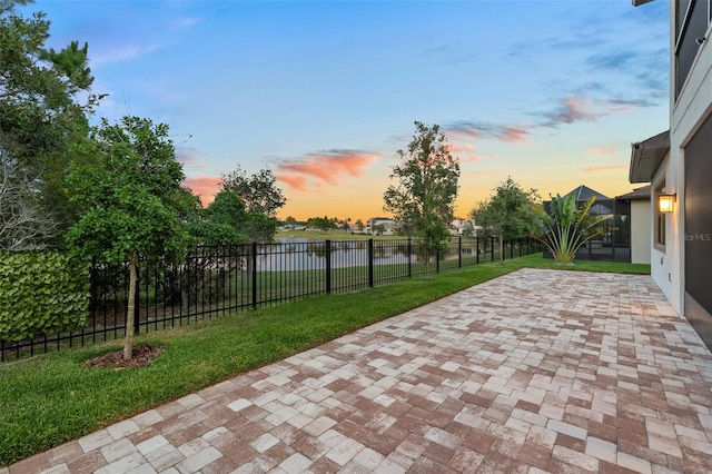 patio terrace at dusk with a yard