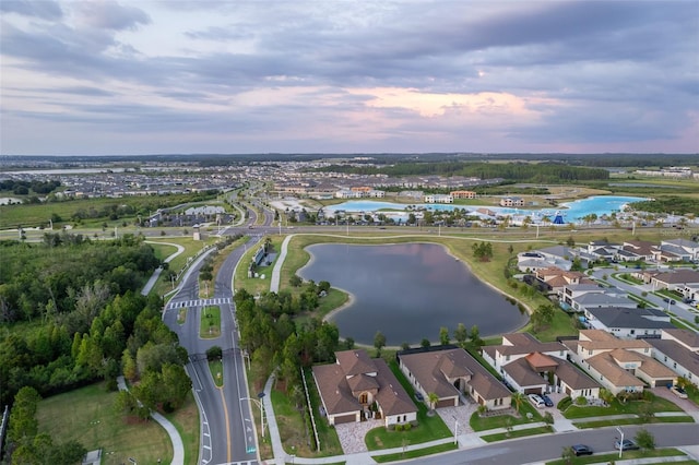 aerial view at dusk with a water view