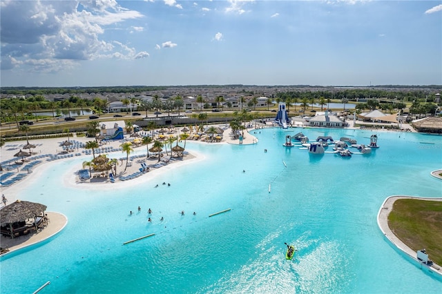 drone / aerial view with a beach view and a water view