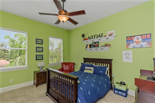 carpeted bedroom with ceiling fan