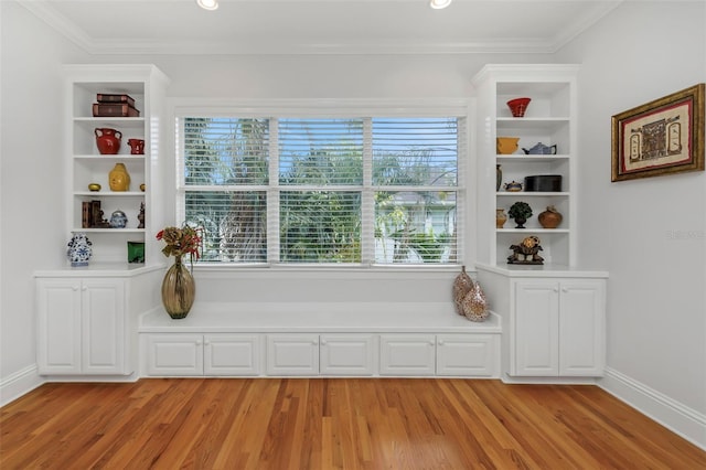 unfurnished room featuring crown molding and light hardwood / wood-style floors