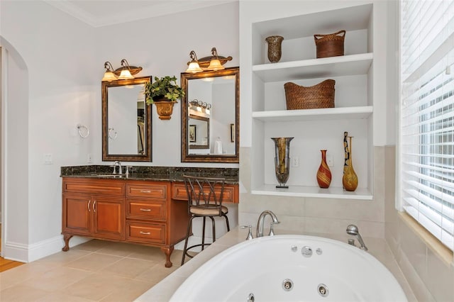 bathroom featuring tiled tub, tile patterned flooring, vanity, and ornamental molding