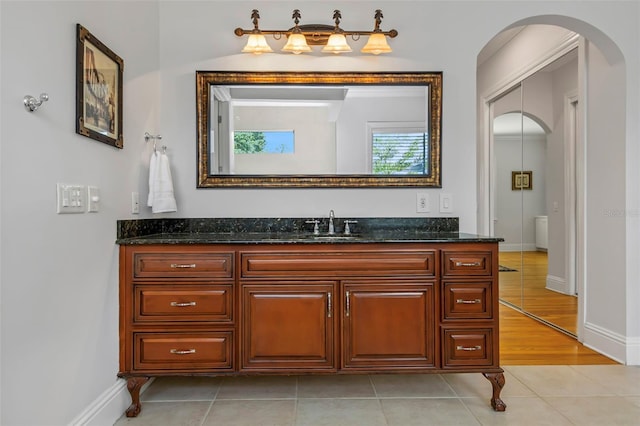 bathroom with tile patterned flooring and vanity