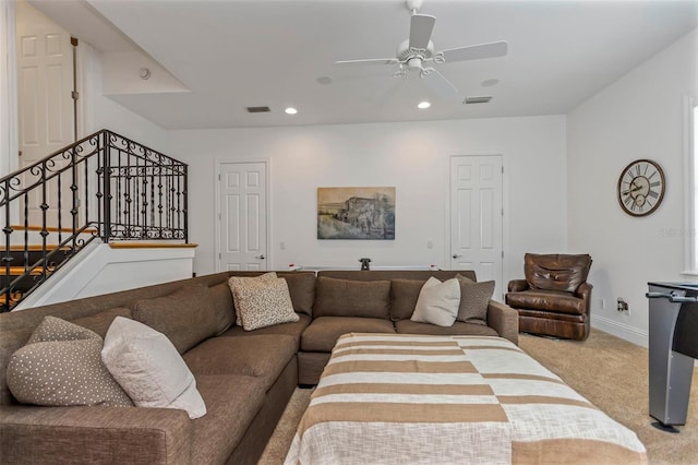 living room with light colored carpet and ceiling fan