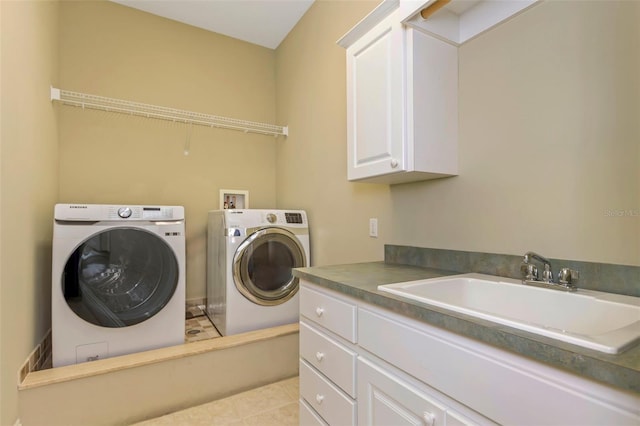 laundry room featuring cabinets, washing machine and dryer, light tile patterned flooring, and sink