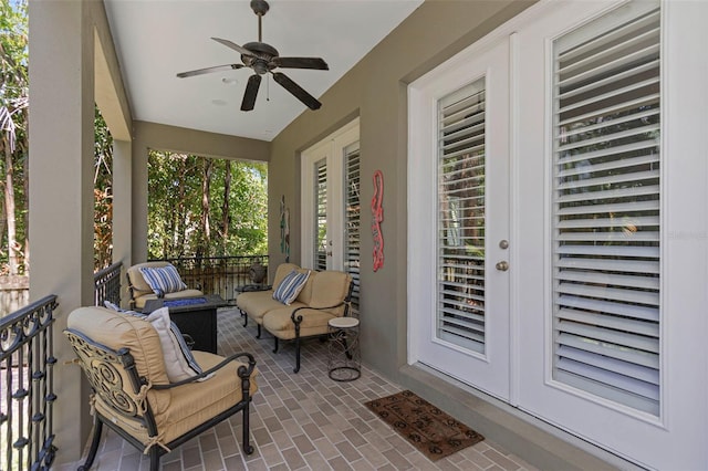 sunroom featuring ceiling fan