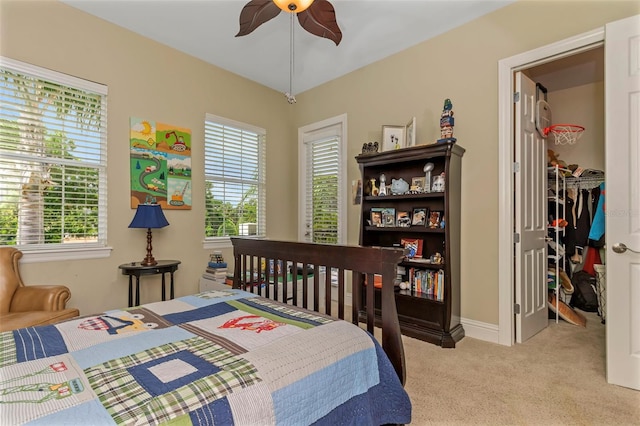 carpeted bedroom with ceiling fan