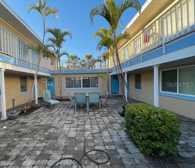 surrounding community featuring a patio