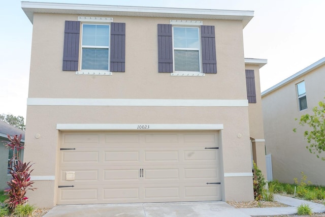 view of front of property with a garage