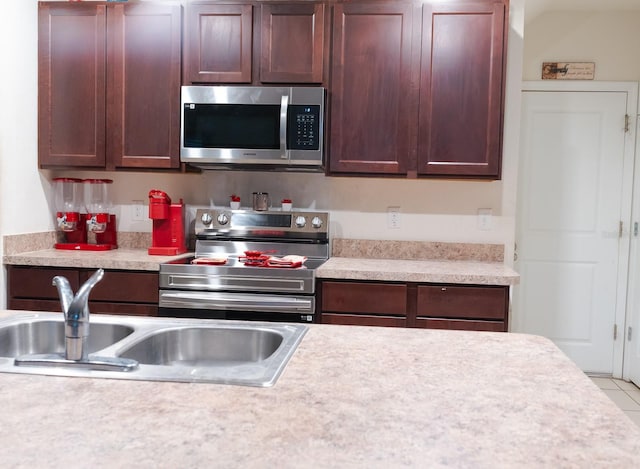 kitchen with sink and appliances with stainless steel finishes