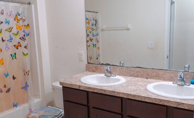 full bathroom with vanity, toilet, and shower / bath combo