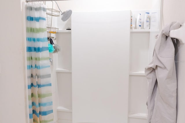 bathroom with a shower with shower curtain