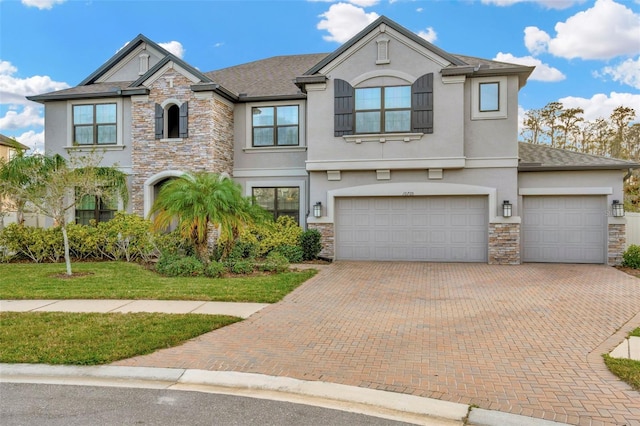 view of front of home featuring a front lawn and a garage