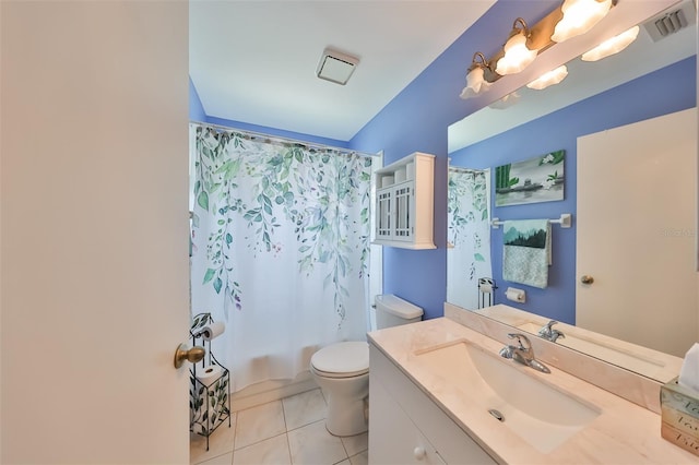 full bathroom with tile patterned floors, shower / bath combo with shower curtain, vanity, and toilet