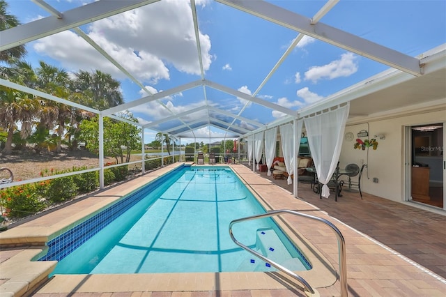 view of pool featuring a patio area and a lanai