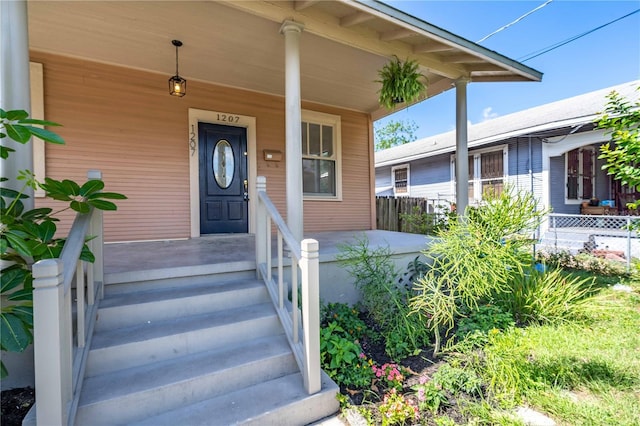 property entrance featuring covered porch