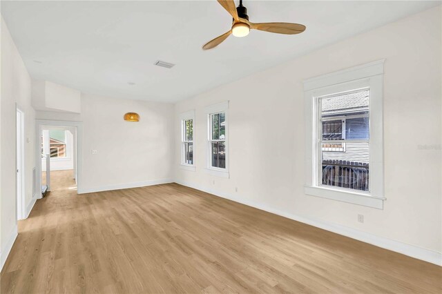 interior space with a healthy amount of sunlight, ceiling fan, and light hardwood / wood-style flooring