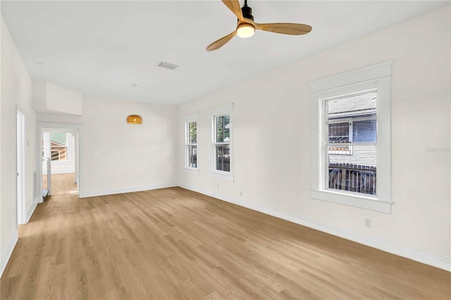 spare room featuring ceiling fan and light wood-type flooring