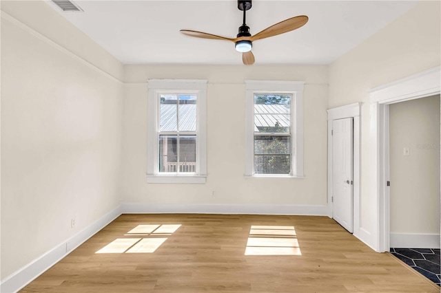 unfurnished room with light hardwood / wood-style floors and ceiling fan