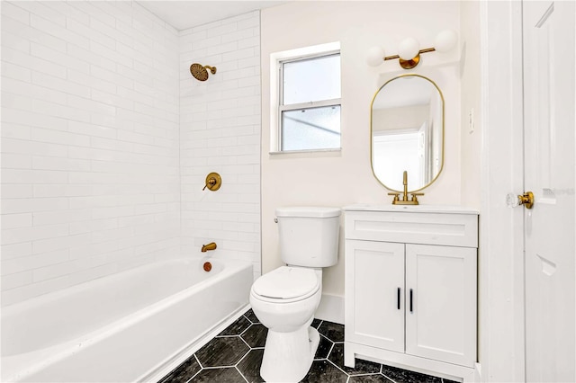 full bathroom featuring tile patterned flooring, vanity, tiled shower / bath, and toilet