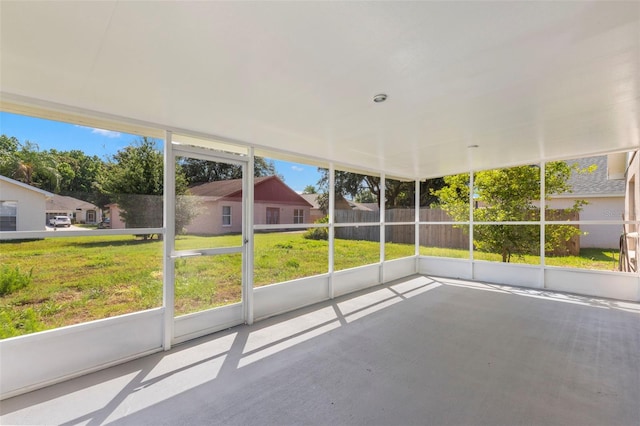 unfurnished sunroom with plenty of natural light