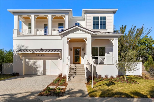 view of front facade with a garage and a front lawn