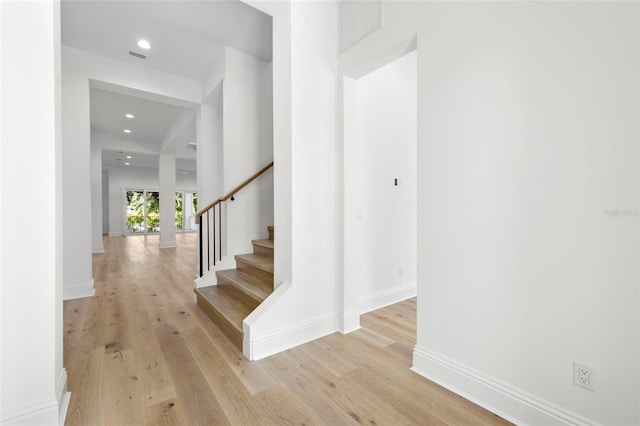 stairs with wood-type flooring