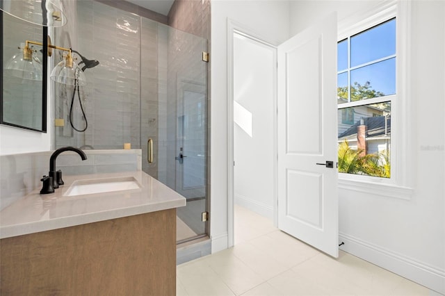 bathroom with vanity, tile patterned flooring, and a shower with door