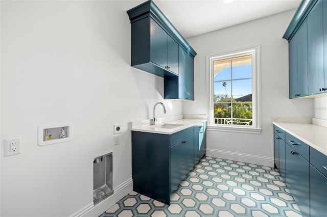 laundry room with sink, hookup for a washing machine, cabinets, and hookup for an electric dryer