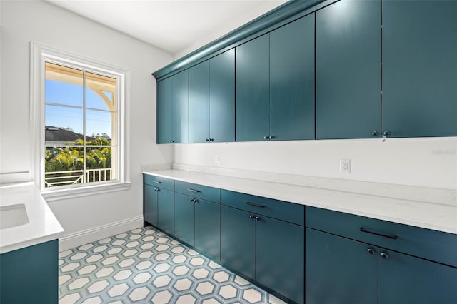 washroom with sink and light tile patterned floors