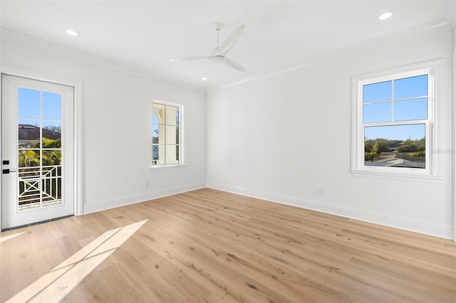 unfurnished room featuring crown molding, a healthy amount of sunlight, ceiling fan, and light hardwood / wood-style flooring